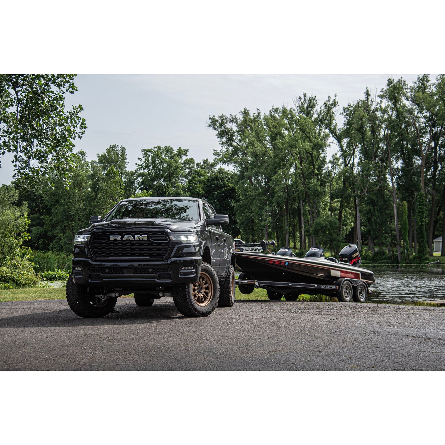 BDS Suspension lift kit on 2025-2026 RAM 1500 Rebel with boat in background.