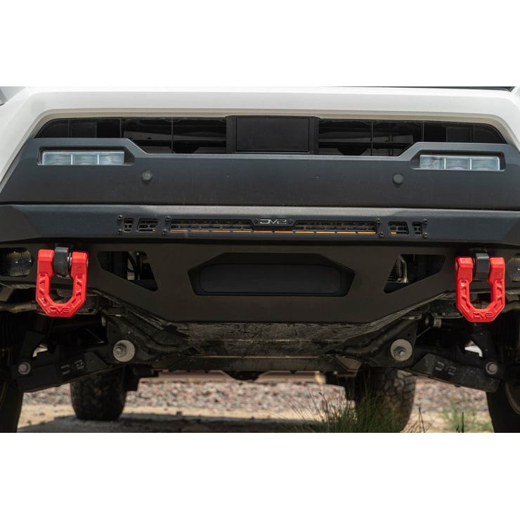 DV8 OFF-ROAD | Winch Fairlead Cover Plate | FBBO-01 installed on an off-road vehicle's bumper with red D-rings.
