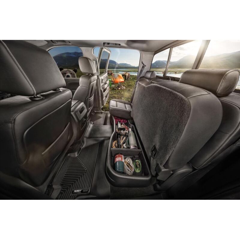 HUSKY | 19-C RAM 1500 CREW CAB BLACK UNDER SEAT STORAGE BOX W/O FACTORY STORAGE | 09421 is shown organizing tools under the back seat.