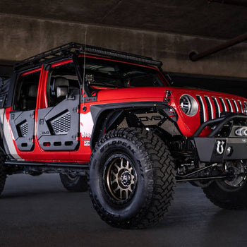 Rugged Off Road Exterior Accessories enhancing the appearance of a modified Jeep in a parking garage.