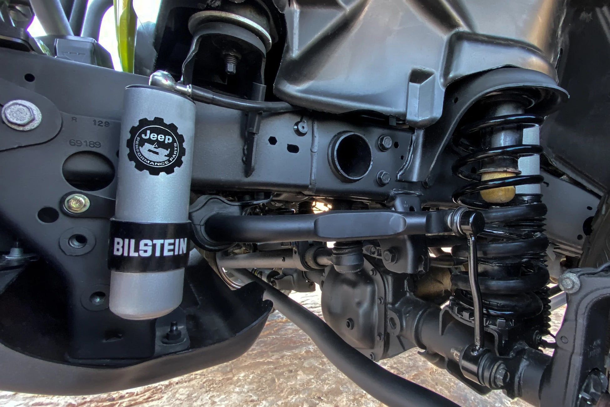 Close-up of Premium Off Road Suspension Parts featuring Bilstein shock absorber in a Jeep
