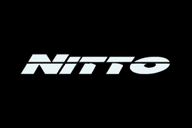 NITTO TIRES logo displayed on a black background representing high-performance tires.
