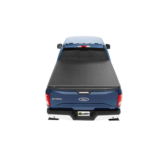BESTOP | EZ-Roll Soft Tonneau Cover For Ford 1983-2011 Ranger 6.0 Foot Black Tailgate Spoiler Not Included Bestop | 19030-01 on a blue truck.