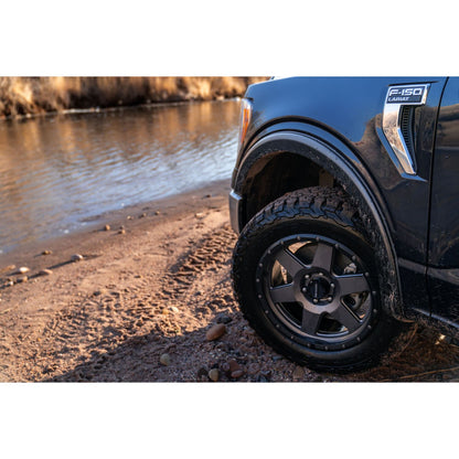 Husky Liners | OE Style Fender Flares Black Smooth Finish 4-Piece Set For 2021-2026 F-150 Husky Liners | 2802962 on a truck by the water.