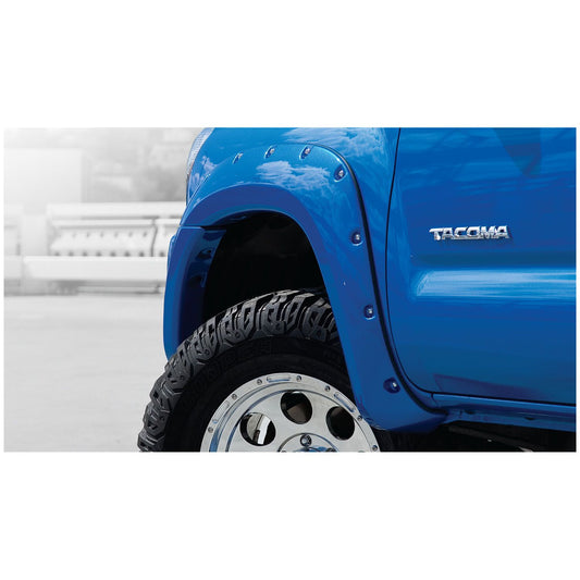 Husky Liners | Pocket Style Fender Flare 4 PC Set For 2005-2011 Tacoma Husky Liners | 28031925 installed on blue Tacoma truck.