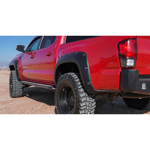Husky Liners | Pocket Style Fender Flare 4 PC Set For 2016-2023 Tacoma Husky Liners | 2803922 on red Tacoma with oversized tires.