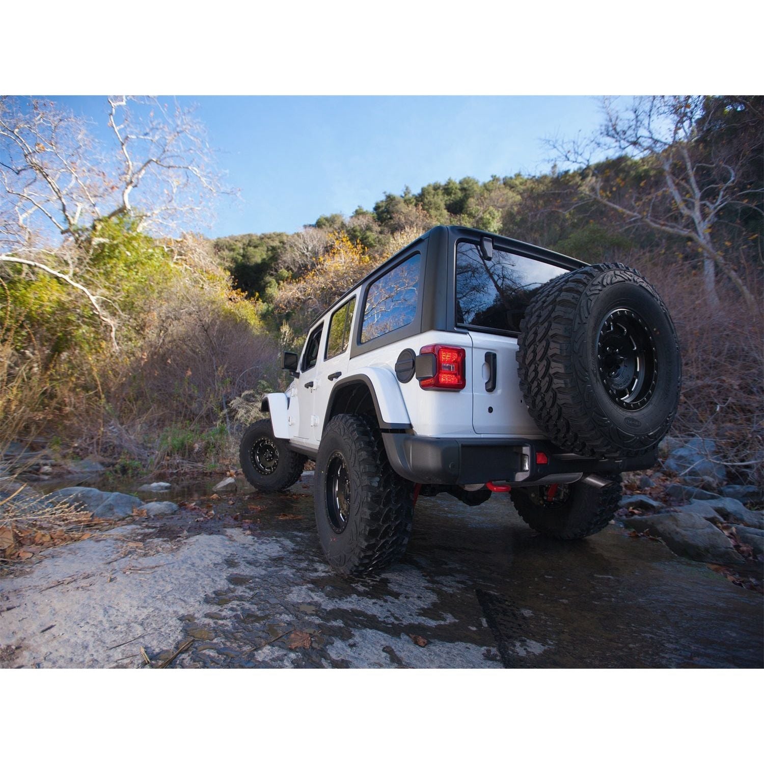 SMITTYBILT | JL Tire Relocation Bracket 2018-Up Jeep Wrangler JL Smittybilt |7721 on a customized 2018 Jeep JL with off-road tires.
