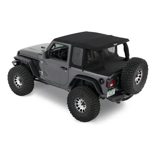 Bestop Halftop Soft Top Conversion Kit Black Diamond I 80102-35 installed on a gray Jeep Wrangler with off-road tires.