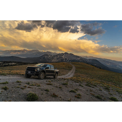 FOX | Shock Absorber 19-On Ford Raptor Front Coilover Live Valve Internal Bypass 3.0 Series Remote Reservoir 7.9 Inch 0-2 Inch Lift Kit | 883-06-153 on a mountain trail.