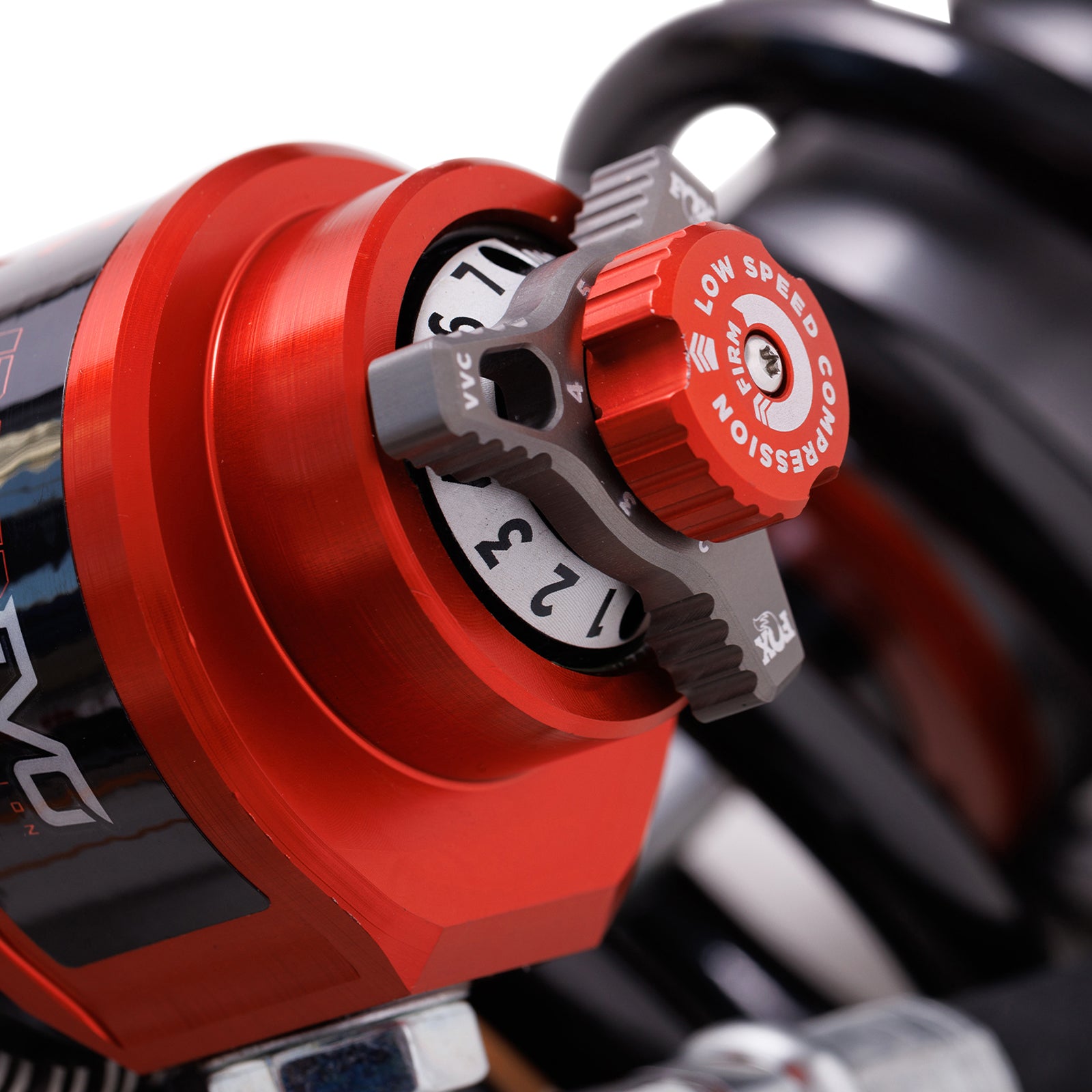 FOX | Shock Absorber 24-On Toyota Tacoma Front Coilover Internal Bypass 3.0 Series Remote Reservoir Dual Speed Compression Evo 2-3 Lift Kit | 883-06-232 close-up of adjustment knob.