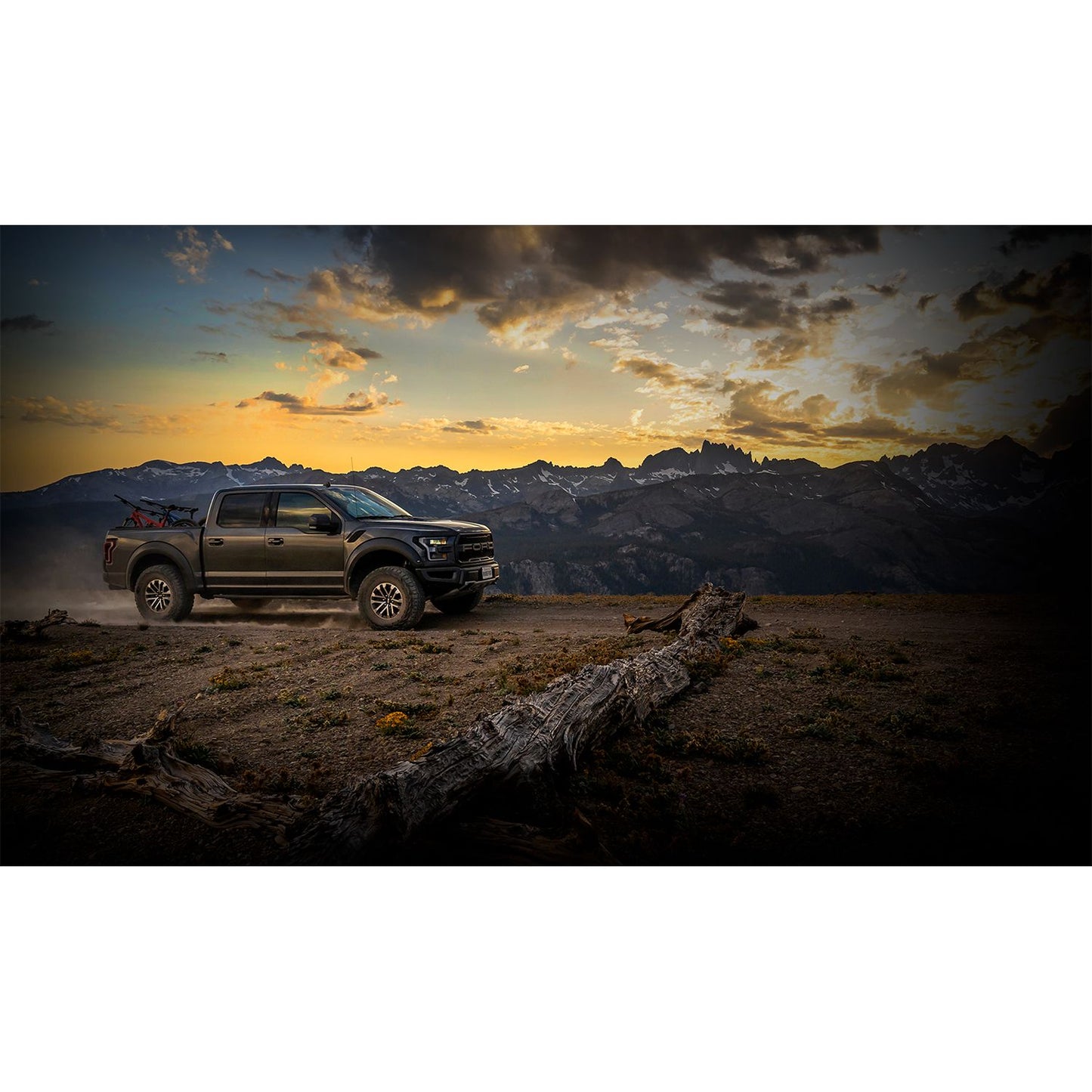 FOX | Shock Absorber 19-On Ford Raptor Rear Live Valve Internal Bypass 3.0 Series Piggy-Back External Cooler 12.3 Inch 0-1 Inch Lift Kit | 883-09-153 installed on Raptor in mountain landscape.