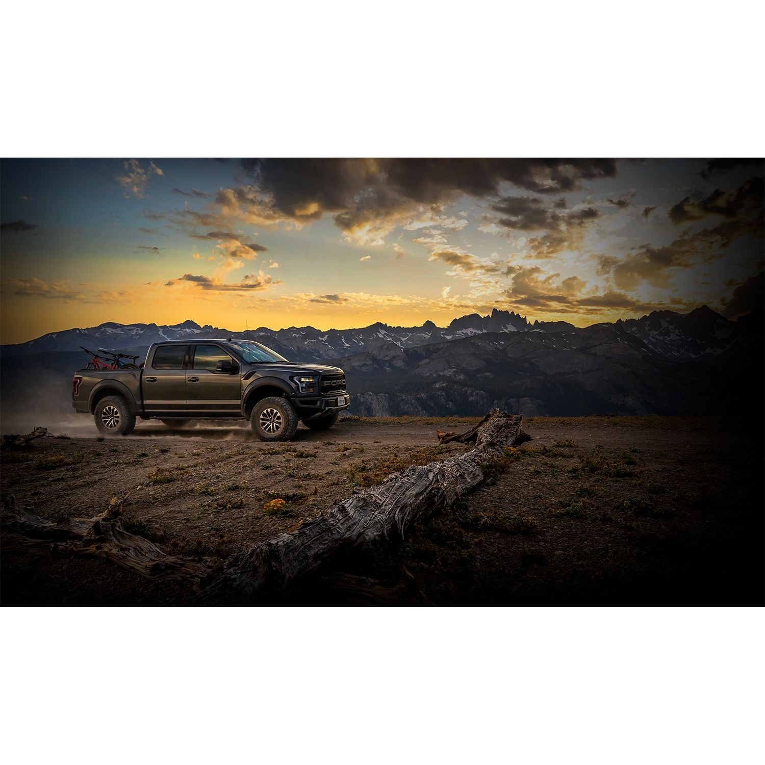 FOX | Shock Absorber 19-On Ford Raptor Rear Live Valve Internal Bypass 3.0 Series Piggy-Back External Cooler 12.3 Inch 0-1 Inch Lift Kit | 883-09-153 installed on Raptor in mountain landscape.