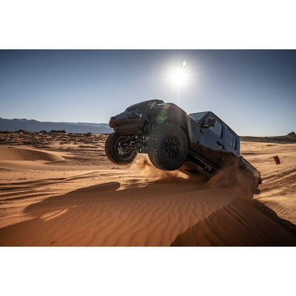 FOX | Shock Absorber 20-On Jeep Gladiator JT Gladiator Front Internal Bypass 3.0 Series Remote Reservoir 3.5-4.5 Inch Lift Dual Speed Compression Requires Front Driveshaft Kit | 883-26-082 in action over sand dunes