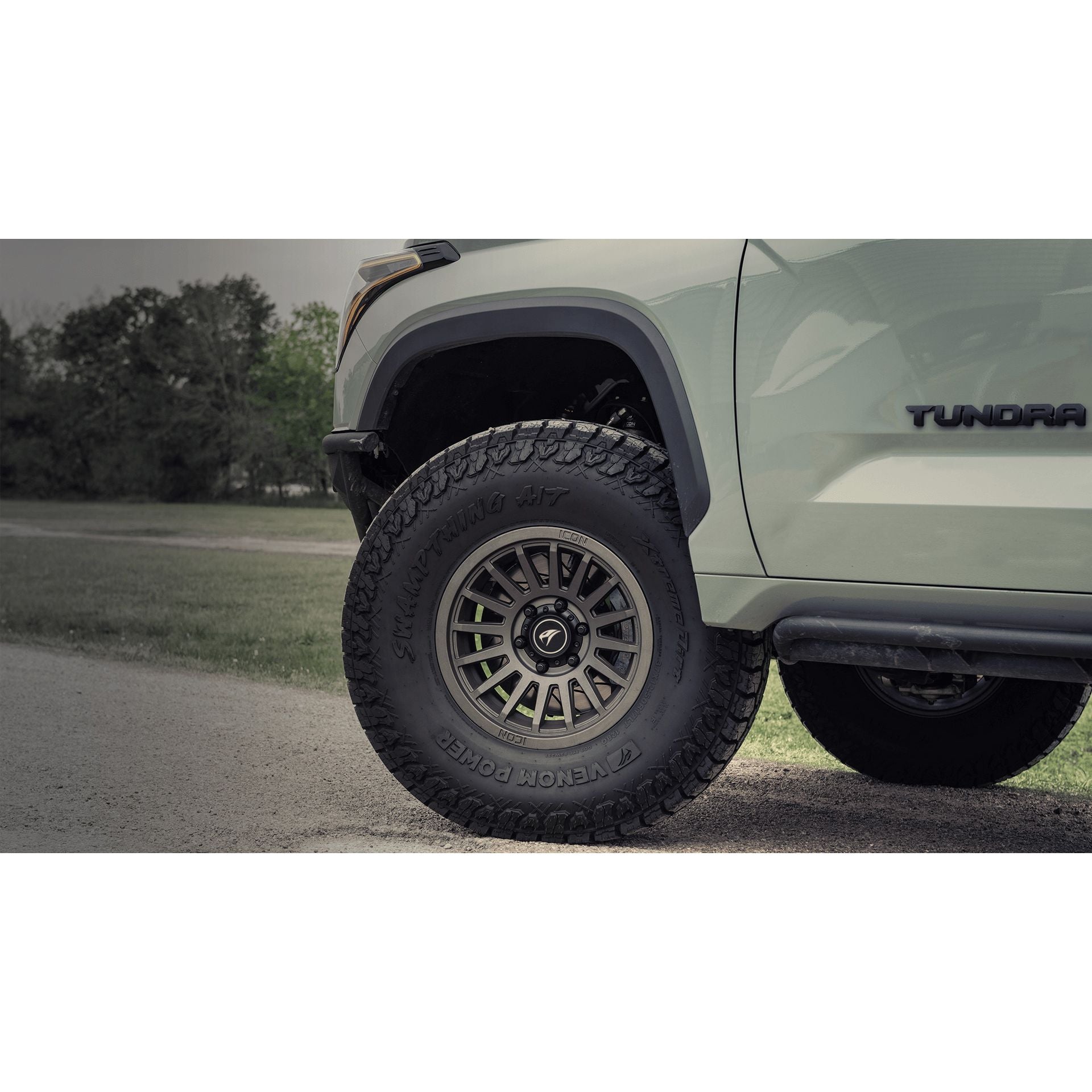 VENOM Swampthing A/T tire mounted on a vehicle showcasing rugged all-terrain design and style.