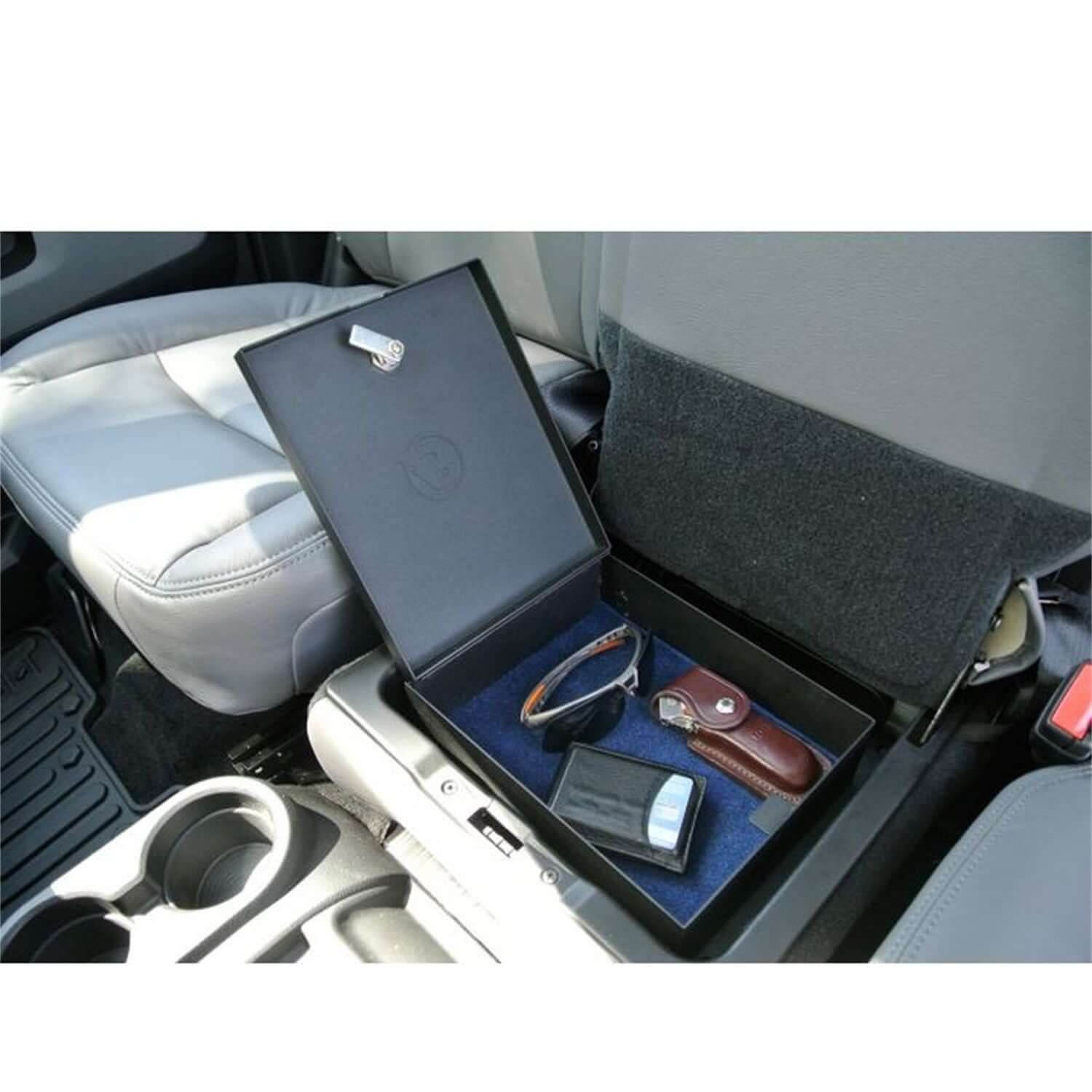 Underseat Lock Box Black Incl. Security Cable/Key Lock I 42644-01 with sunglasses and wallet inside a vehicle.