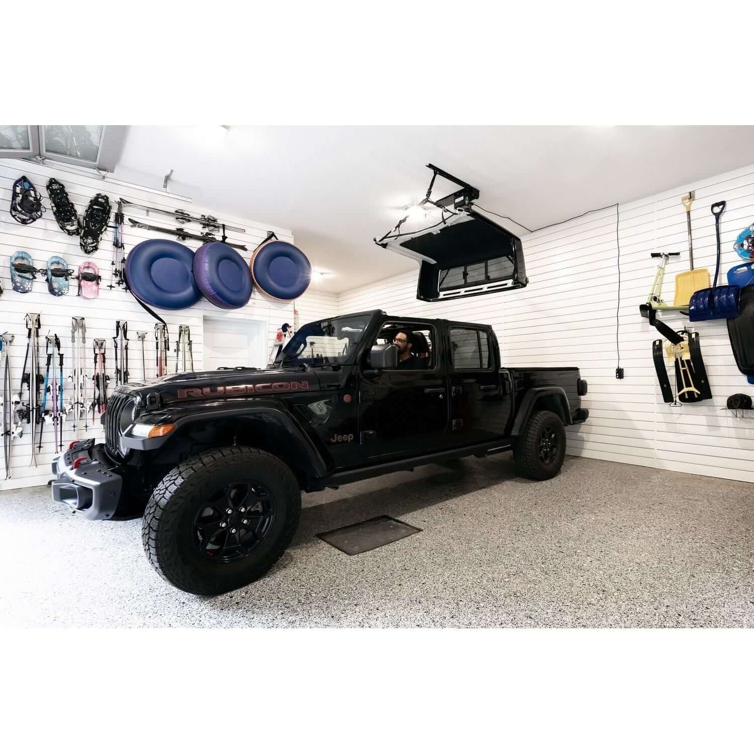 BESTOP | HOSS Hardtop Hoist Jeep 2018-26 Wrangler JL Black Bestop | 42820-01 in a garage setting with a black Jeep.