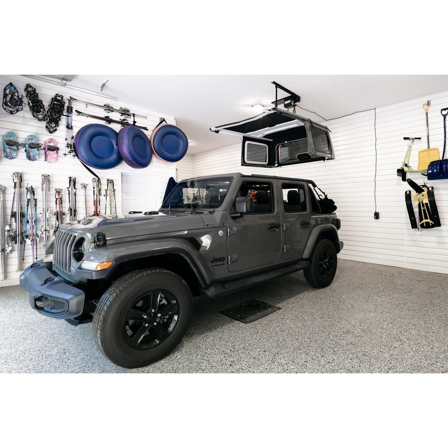 BESTOP | HOSS Hardtop Hoist Jeep 2018-26 Wrangler JL Black Bestop | 42820-01 in garage with hardtop lifted.