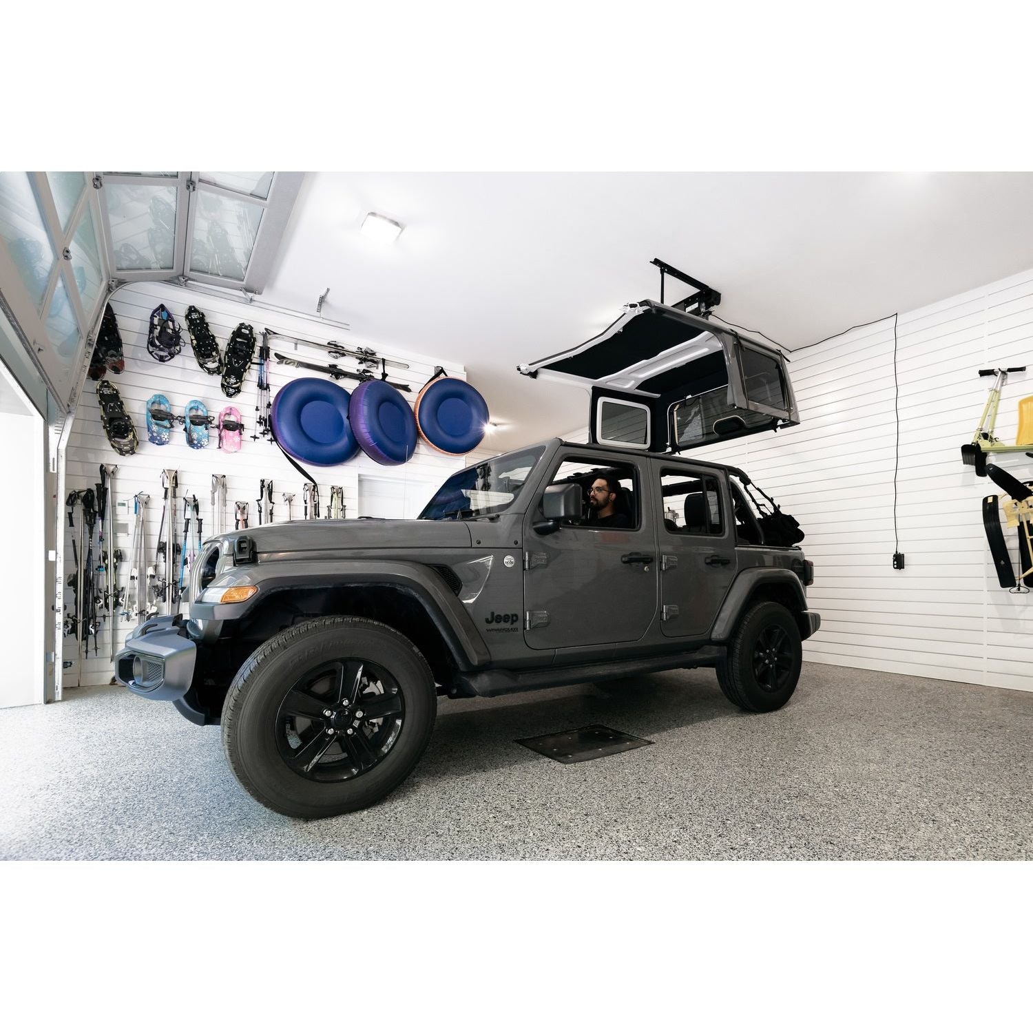 Jeep using BESTOP | HOSS Hardtop Hoist Jeep 2018-26 Wrangler JL Black Bestop | 42820-01 in garage for hardtop removal.