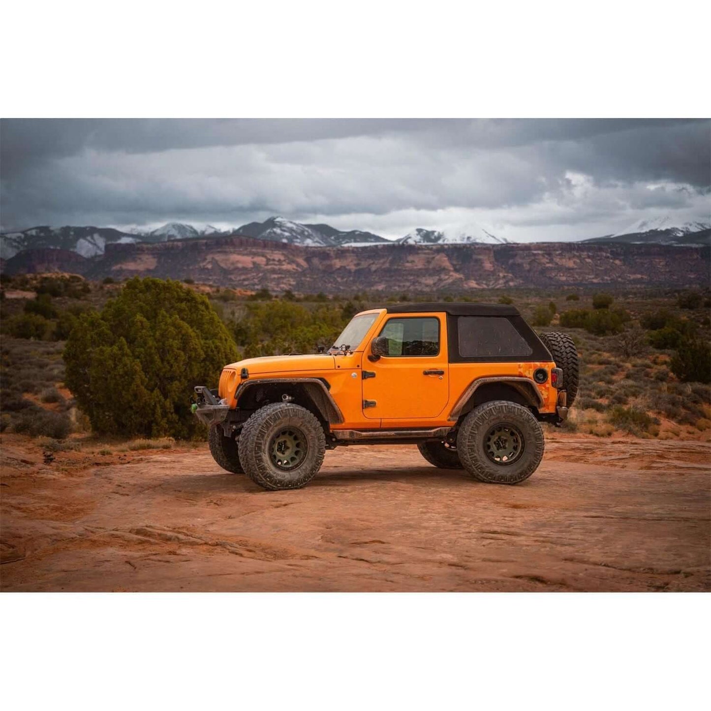 BESTOP | Trektop Glide 2-Door for JL Jeep 2018-26 Wrangler JL Premium Black Twill Bestop | 54930-17 on an orange Jeep.