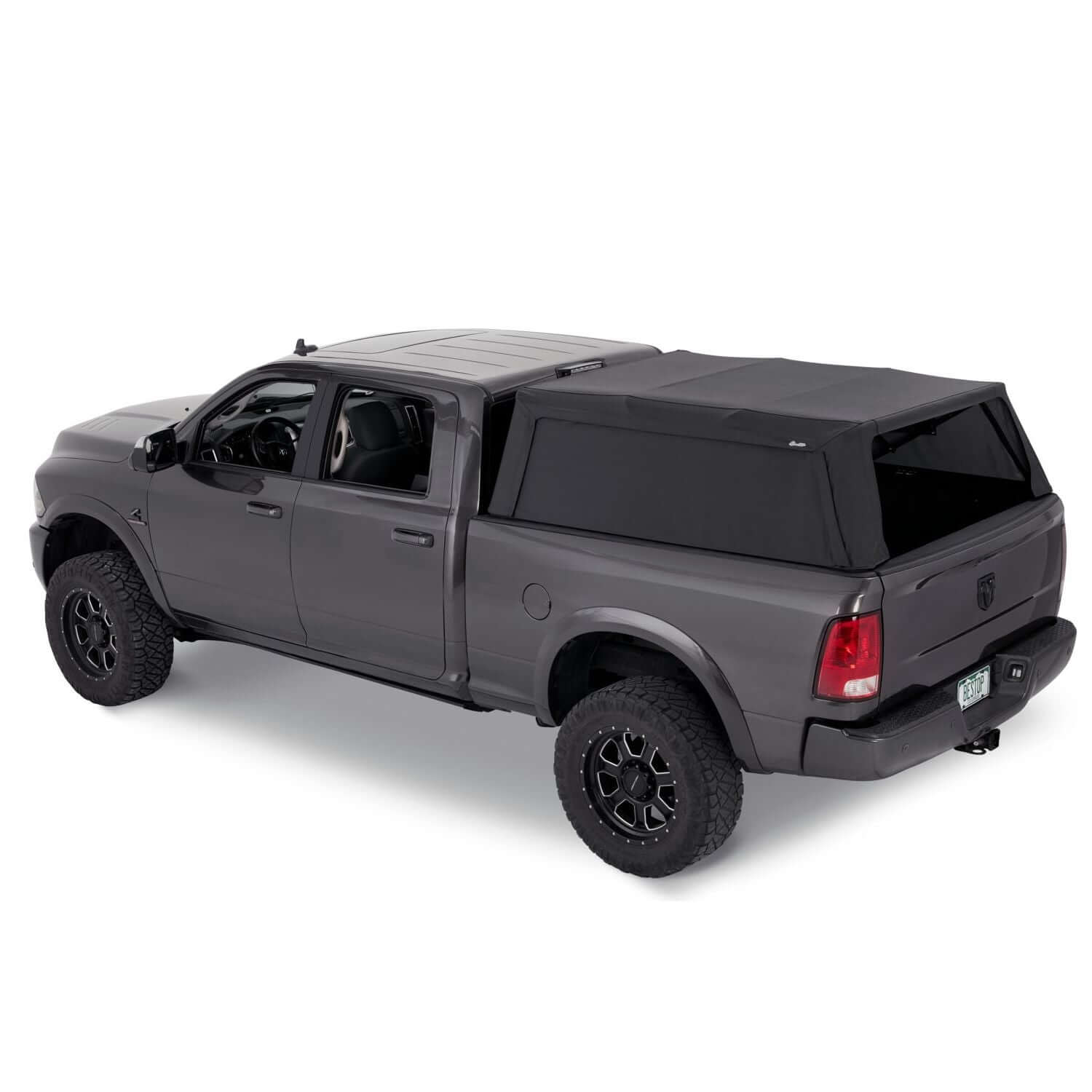BESTOP | Supertop Truck Bed Cap 2 For Supertop for Truck 2 - '19-2024 Ram 1500 5.7 Foot Black Diamond PVC Coated Sailcloth No Drill Bestop | 77327-35 on a grey Ram 1500 truck.