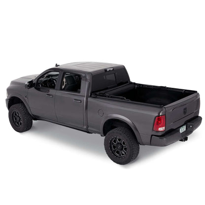 BESTOP | Supertop Truck Bed Cap 2 For Dodge 2009-10 Ram 1500 6.5 Foot Black Diamond PVC Coated Sailcloth No Drill Bestop | 77328-35 installed on a grey truck.