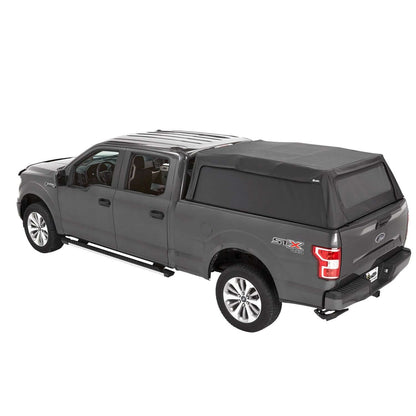 BESTOP | Supertop Truck Bed Cap 2 For Ford 2017-2024 F-250SD/F-350SD 6.8 Foot Black Diamond PVC Coated Sailcloth No Drill Bestop | 77334-35 installed on a gray Ford truck.