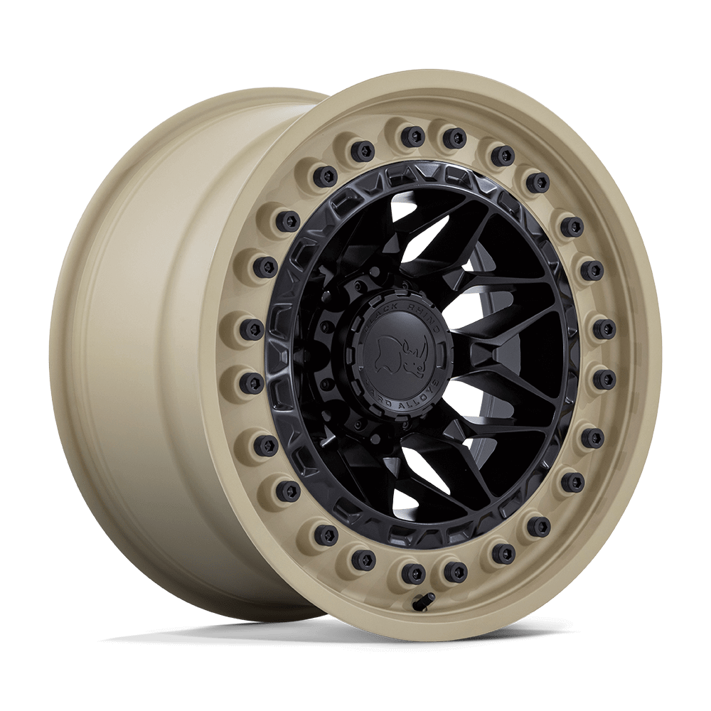 Black Rhino ALPHA Matte Black W/ Sand Lip wheel showcasing motorsports-inspired design on a beige background.
