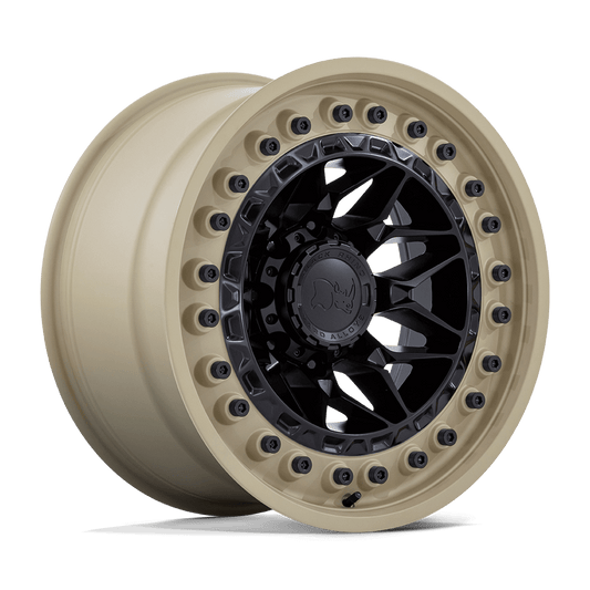 Black Rhino ALPHA Matte Black W/ Sand Lip wheel showcasing motorsports-inspired design on a beige background.