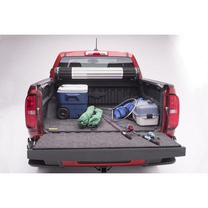 BedRug Bedmat For Spray-In Or No 15-22 Colorado/Canyon 5' Bed 3/4 Inch Thick Bed Mat - Charcoal (BMB15CCS) in a truck bed with gear.