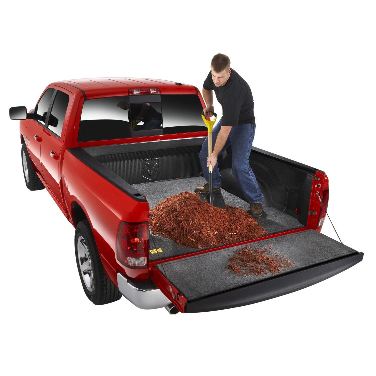 BedRug 05-21 Nissan Frontier 5' Bed Mat - Charcoal (BMN05CCD) shown in use with mulch in a truck bed.