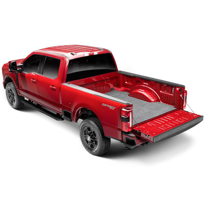 BedRug Bedmat For Spray-In Or No 17-26 Ford Super Duty 8' Bed 3/4 Inch Thick Bed Mat - Charcoal (BMQ17LBS) installed in a red Ford Super Duty.