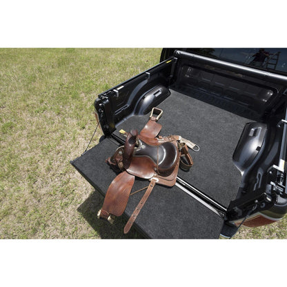 BedRug Bedmat For Spray-In Or No Bed Linr 02-18 Ram 1500 8' 3/4 Inch Thick Bed Mat - Charcoal (BMT02LBS) with saddle on truck bed.