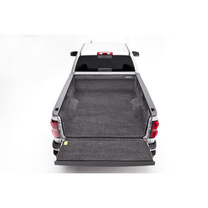 BedRug 07-18 Silverado/Sierra 8' Bed w/o Cargo Channel System Bed Liner w/ Tailgate Mat - Charcoal (BRC07LBK) installed in truck bed.