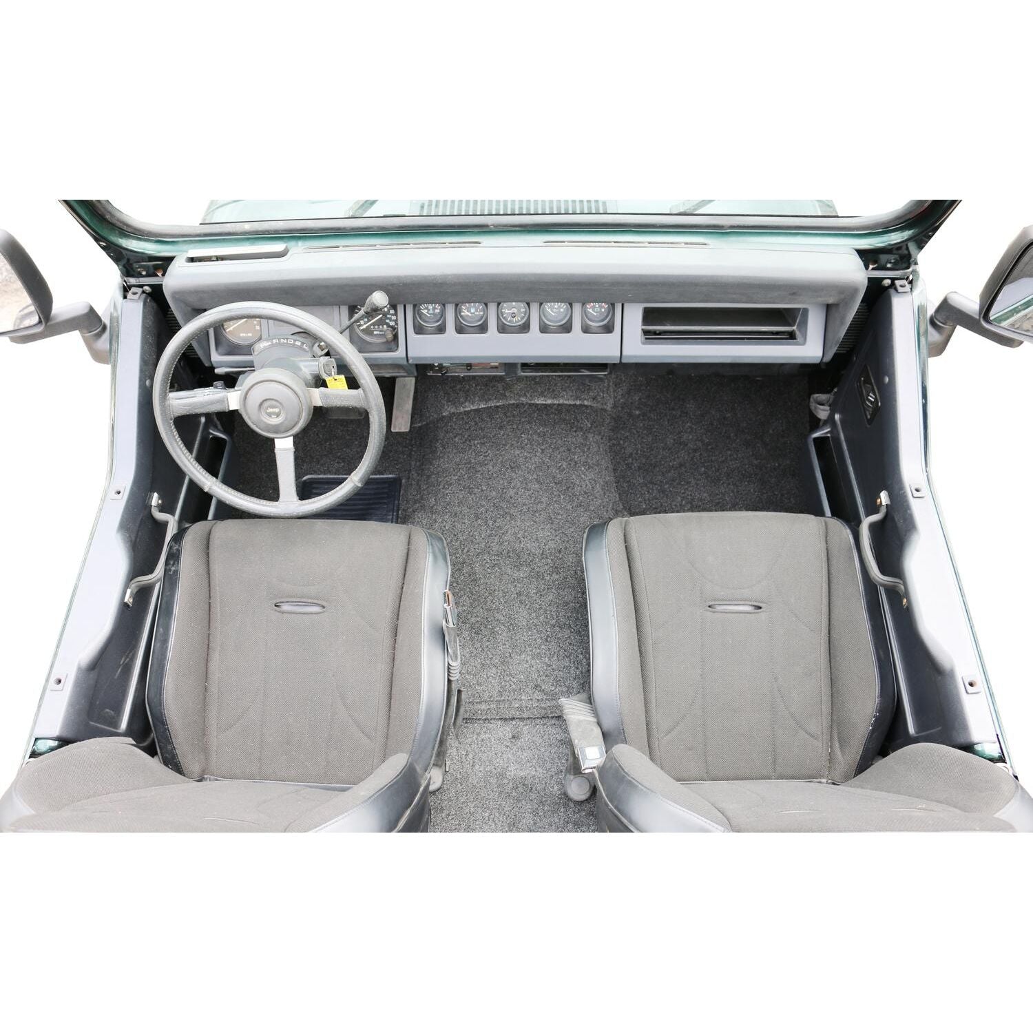 Interior view of Jeep showing BedRug Jeep 76-95 Jeep Cj-7/Yj Front Kit 8Pc Floor Kit - Charcoal with heat shields.