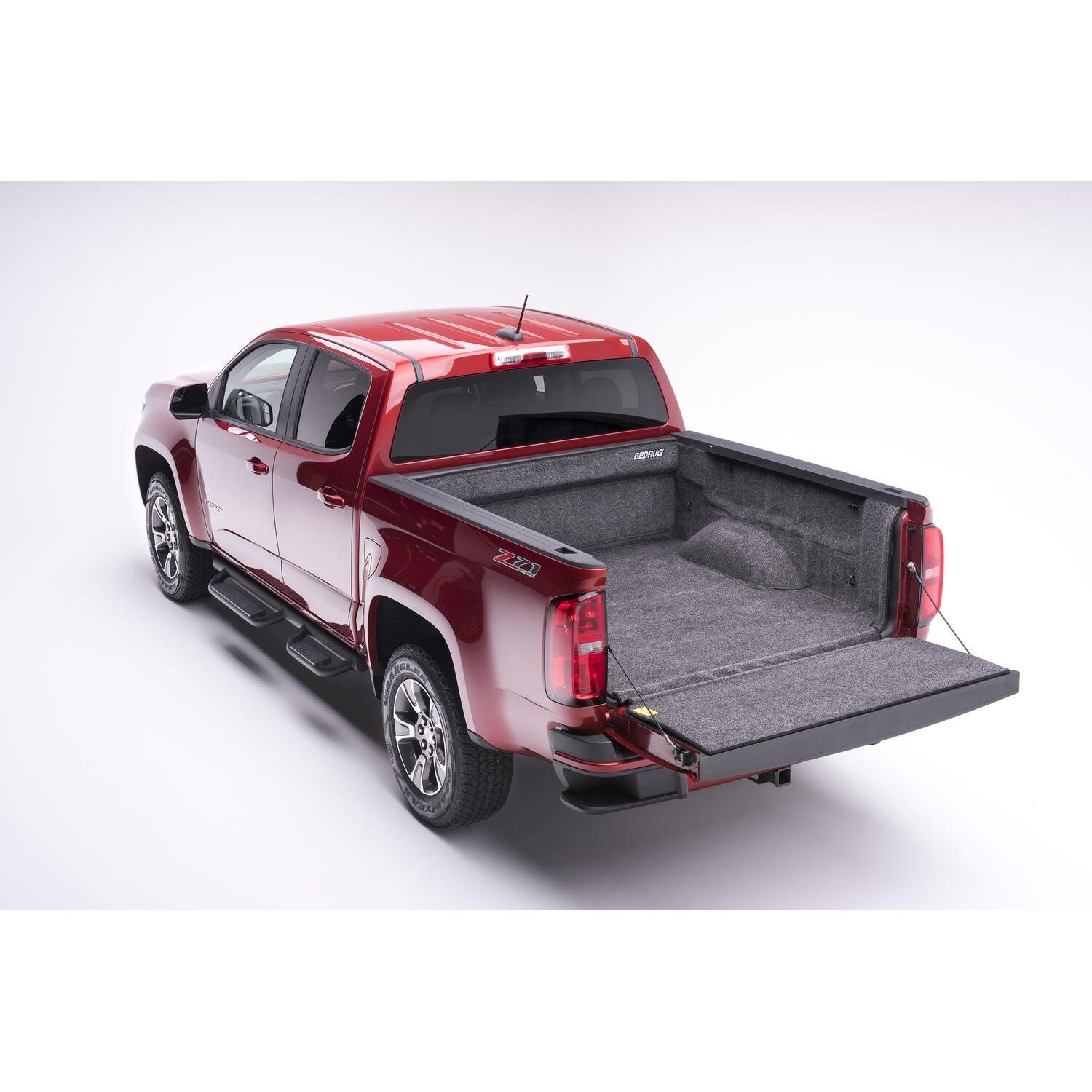 BedRug 2020-2025 Jeep Gladiator Bed Liner w/ Tailgate Mat - Charcoal (BRJ20SBK) installed in a red truck bed.
