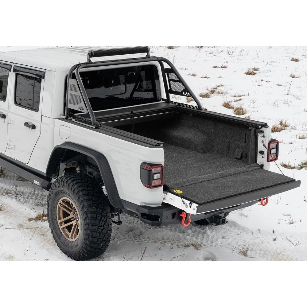 BedRug 2020-2025 Jeep Gladiator Bed Liner w/ Tailgate Mat - Charcoal (BRJ20SBK) installed on a Jeep Gladiator in snow.