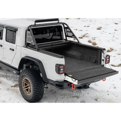 BedRug 2020-2025 Jeep Gladiator Bed Liner w/ Tailgate Mat - Charcoal (BRJ20SBK) installed on a Jeep Gladiator in snow.