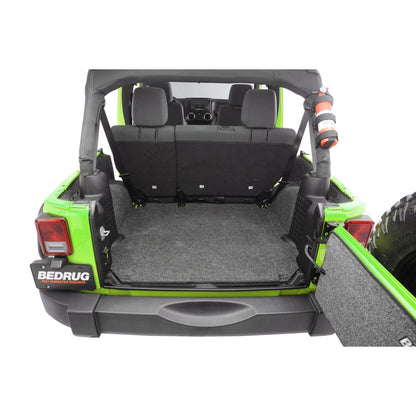 BedRug Jeep 11-18 JK Unltd 4Dr RR 5Pc Cargo Kit - Charcoal in the rear cargo area of a Jeep.