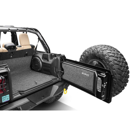 BedRug 2018-2026 Jeep Wrangler 4 Door Bed Liner - Charcoal (BRJL18R4GH) installed in the rear of a Jeep Wrangler.