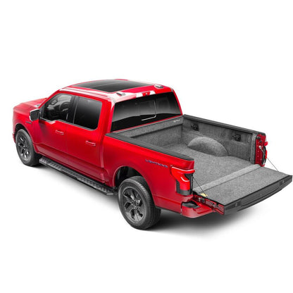 BedRug 22-25 Ford Maverick Bed Liner w/ Tailgate Mat - Charcoal (BRM22SBK) installed in a red Ford truck bed.