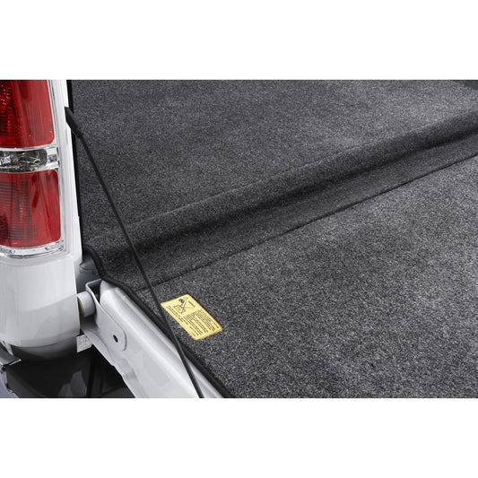 BedRug 04-14 Ford F-150 5.5' Bed w/o Factory Step Gate Bed Liner w/ Tailgate Mat - Charcoal (BRQ04SCK) installed in truck bed.