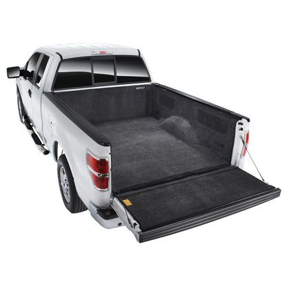 BedRug 09-14 Ford F-150 5.5' Bed w/ Factory Step Gate w/Tailgate Step Bed Liner w/ Tailgate Mat - Charcoal (BRQ09SCSGK) installed in truck bed.