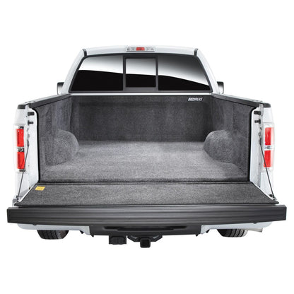 BedRug 99-16 Ford Super Duty 6.5' Bed w/o Factory Step Gate Bed Liner w/ Tailgate Mat - Charcoal (BRQ99SBK) installed in truck bed.