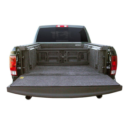 BedRug 09-18 - Charcoal (19-23 Classic) Dodge Ram 5'7" Bed w/ Rambox w/Bed Rail Storage Bed Liner w/ Tailgate Mat in a truck bed.