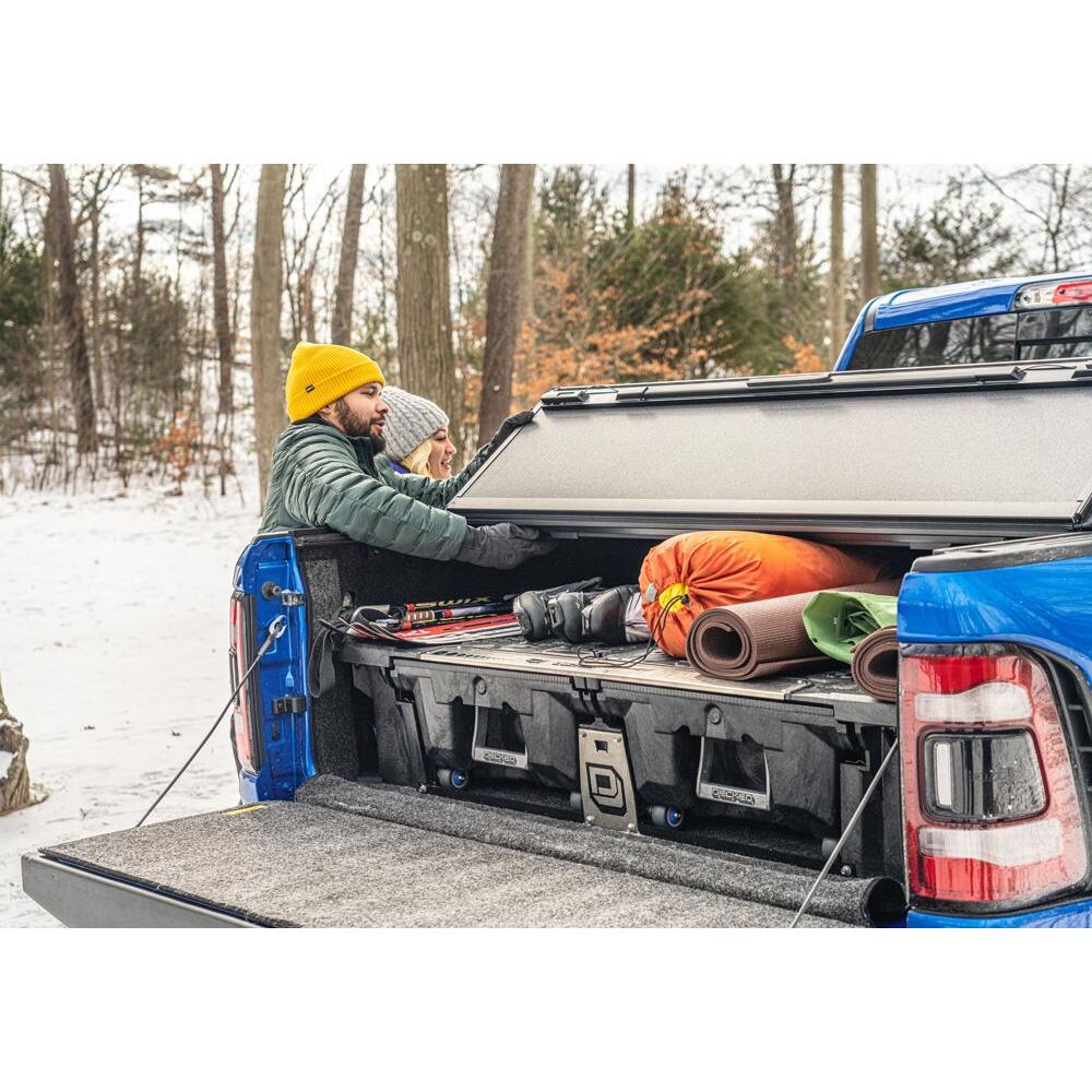 BedRug 2019-2025 Ram 1500 5'7" Bed Liner w/ Tailgate Mat w/o RamBox w/o Multifunction Tailgate - Charcoal (BRT19CCK) in truck bed with camping gear.