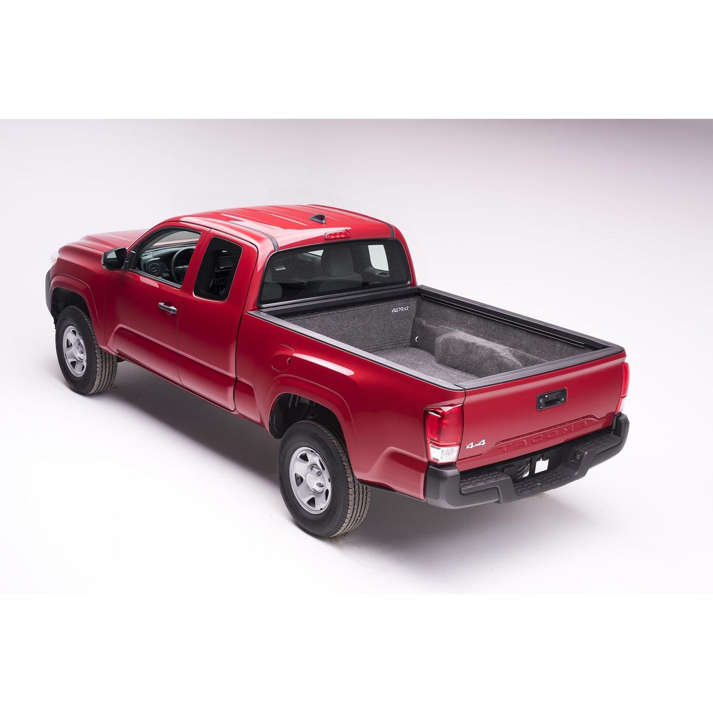 BedRug 05+ Toyota Tacoma 5' Bed Liner w/ Tailgate Mat - Charcoal (BRY19DCK) installed in a red Toyota Tacoma truck.