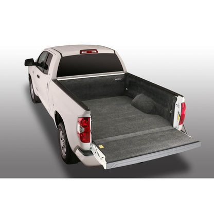 BedRug 22-25 Toyota Tundra 6.5' Bed Liner w/ Tailgate Mat - Charcoal (BRY22RBK) installed in a white truck bed.