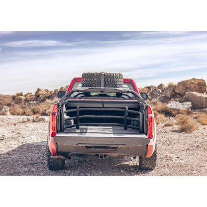 BedRug 22-25 Toyota Tundra 6.5' Bed Liner w/ Tailgate Mat - Charcoal (BRY22RBK) installed in a red truck bed.