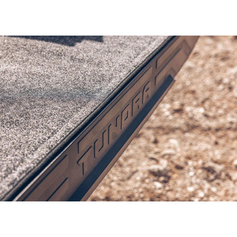 Close-up of BedRug 22-25 Toyota Tundra 6.5' Bed Liner w/ Tailgate Mat - Charcoal, highlighting textured surface.