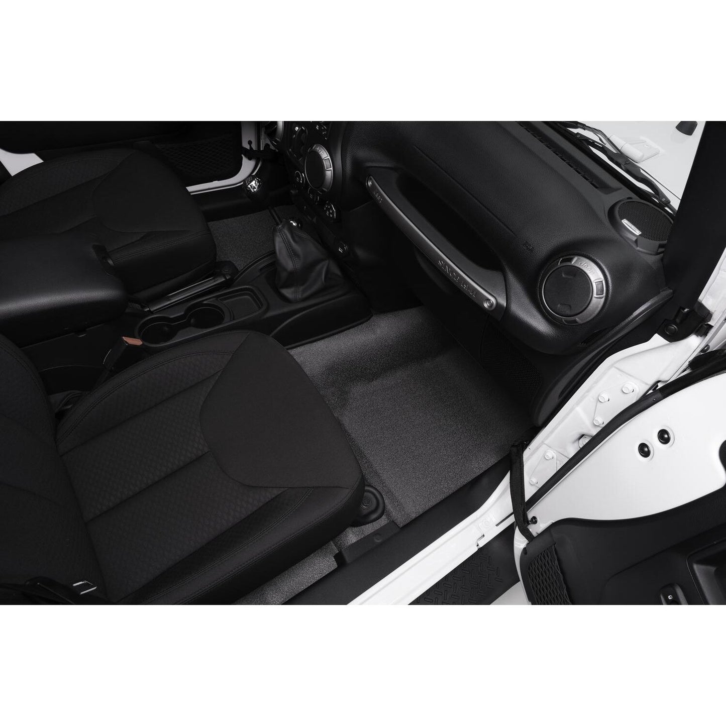Interior view of a Jeep featuring the BedRug Jeep Bedtred 07-18 Jeep JK Unltd 4Dr Front 4Pc Floor Kit - Charcoal Bed Liner.